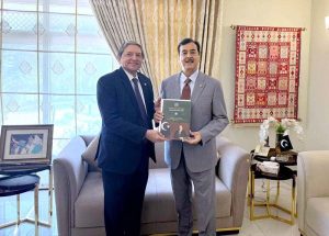 Senator Saleem Mandviwalla presenting the annual report of the Senate Standing Committee on Finance & Revenue to Humble Chairman Senate, Syed Yousaf Raza Gillani.
