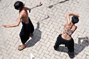 Mourners self-flagellation with knives and chains during a procession on 10th of the Holy Month of Muharram-ul-Harram. Muharram-ul-Harram is the first month of the Islamic calendar known as the mourning month in remembrance of the martyrdom (Shahadat) of Hazrat Imam Hussain (RA), the grandson of the Holy Prophet Muhammad (PBUH)