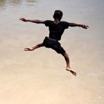 A youngster jumping in Rice Canal to get some relief from scorching hot weather in the city