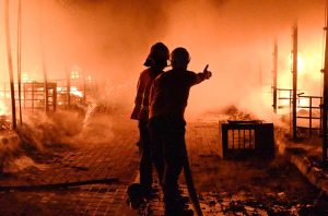 Firefighters and rescue teams battle a massive blaze that broke out at the weekly H-9 Bazaar Peshawar Mor, reducing several shops and stalls to ashes.
