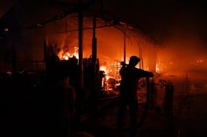Firefighters and rescue teams battle a massive blaze that broke out at the weekly H-9 Bazaar Peshawar Mor, reducing several shops and stalls to ashes.