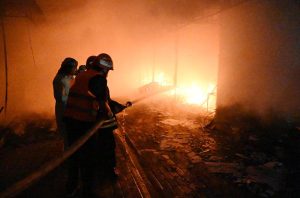 Firefighters and rescue teams battle a massive blaze that broke out at the weekly H-9 Bazaar Peshawar Mor, reducing several shops and stalls to ashes.