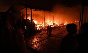 Firefighters and rescue teams battle a massive blaze that broke out at the weekly H-9 Bazaar Peshawar Mor, reducing several shops and stalls to ashes.