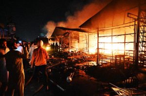 Firefighters and rescue teams battle a massive blaze that broke out at the weekly H-9 Bazaar Peshawar Mor, reducing several shops and stalls to ashes.