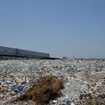 A large heap of garbage and waste lies unattended near a vegetable market, highlighting the poor sanitation and waste management situation that demands urgent attention from the concerned authorities