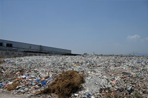 A large heap of garbage and waste lies unattended near a vegetable market, highlighting the poor sanitation and waste management situation that demands urgent attention from the concerned authorities
