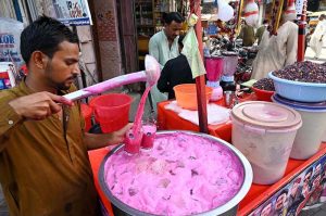 A vendor selling traditional summer drink at Royal Road during scorching hot weather in the city.