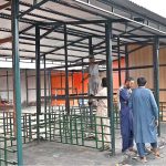 Workers are busy constructing stalls as reconstruction work continues at the H-9 Weekly Bazaar, which burnt in fire incident
