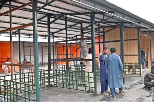Workers are busy constructing stalls as reconstruction work continues at the H-9 Weekly Bazaar, which burnt in fire incident