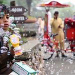 A young vendor is making bubbles with a bubble-making toy to attract children and sell the toy at the famous picnic point, Daman-e-Koh