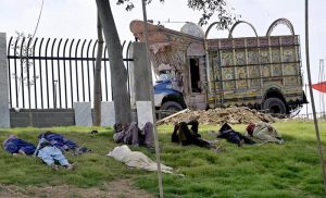 Labourers are enjoying a nap on the roadside greenbelt along Islamabad Expressway in the Federal Capital.