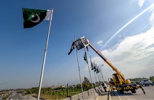 National flags are installed on a bridge at Koral Chowk in connection with the upcoming Independence Day celebrations.