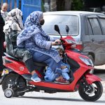 Women on wheels — Two women commuters ride a scooty in Federal Capital, reflecting a growing trend among female students and professionals who are embracing affordable, practical, and empowering mobility options