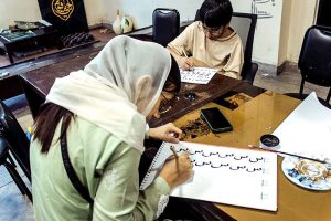 Students participate in drawing, painting and calligraphy activities during the Summer Camp at Alhamra Arts Council.