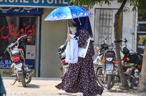 Women on wheels — Two women commuters ride a scooty in Federal Capital, reflecting a growing trend among female students and professionals who are embracing affordable, practical, and empowering mobility options