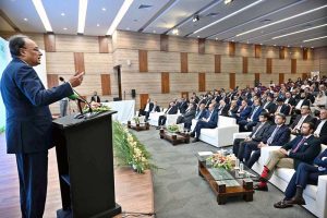 Federal Minister for Finance and Revenue, Senator Muhammad Aurangzeb addressing the launching ceremony of InvestPak, a web portal to digitize the process of investment in government securities, during a ceremony held at the State Bank of Pakistan Auditorium.