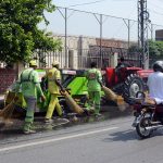 Sanitary workers wash LMQ Road during the "Saaf Suthra Punjab" cleanliness campaign to improve sanitation and maintain a clean environment in the city