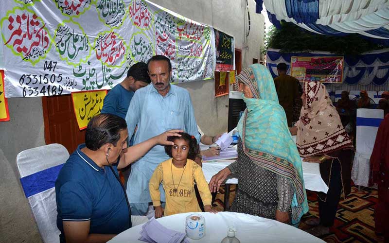 Doctor examine patients and provide free medical tests and medicines during a free medical camp organized under the supervision of Islamia Hospital