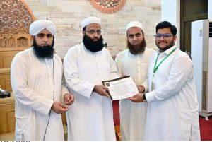 Scholar Mufti Jahangir Abbasi distributes certificates among participants during the concluding ceremony of the Islamic Summer Camp at Jamia Masjid, C Block, Media Town.