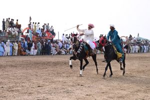 Horse riders in action during traditional game Malhakhra during the 283rd Urs celebration of Hazrat Shah Abdul Latif Bhitai.