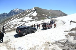 Tourists visit and enjoy the scenic beauty of Burzil Top (Burzil Pass), a historic mountain pass at an elevation of 13,808 feet in the Himalayas. The pass connects Astore Valley with the picturesque Minimarg and Domel regions and, before the partition of the subcontinent, served as a major caravan route linking Srinagar with Gilgit and Skardu