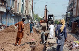 WASA workers are laying new WASA pipeline at Aminpur Bazaar with heavy machinery.