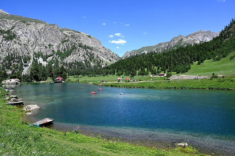 A beautiful view of Rainbow Lake, Rainbow Lake is a stunning, crystal-clear alpine lake located near Domel in the Minimarg Valley of Astore District, Gilgit-Baltistan