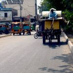 A man travels on a donkey cart carrying household belongings at 9 Number Chungi