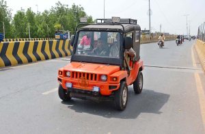 An under-age youngster driving a small vehicle on a busy road, a serious safety hazard that demands urgent action from the concerned authorities.