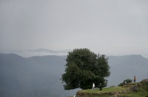 Visitors enjoy the pleasant weather at a village in the hilly resort town of Murree.