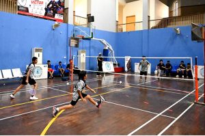 Player in action during inter District Badminton Championship organized by Divisional Sports Department.