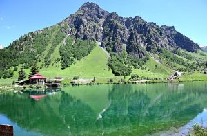 A beautiful view of Rainbow Lake, Rainbow Lake is a stunning, crystal-clear alpine lake located near Domel in the Minimarg Valley of Astore District, Gilgit-Baltistan