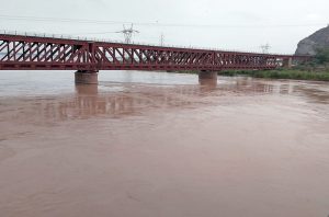 A view of the River Chenab as floodwater spreads across the river channel and inundates the adjoining banks following a rise in the water level.
