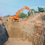 An excavator undertakes excavation work for the installation of a new sewerage and drainage system near Vehari Chowk as part of the city's ongoing infrastructure development project