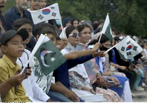 Spectators enjoy the first match of Pakistan-South Korea men's field hockey test series at the Naseer Bunda Hockey Stadium.
