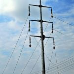 IESCO workers are busy installing new electricity wires on an electric pole at park Road in the Federal Capital