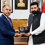 Chairman NDMA Lieutenant General Inam Haider Malik presents a souvenir to Gilgit-Baltistan Chief Minister Amjad Hussain Advocate during a ceremony