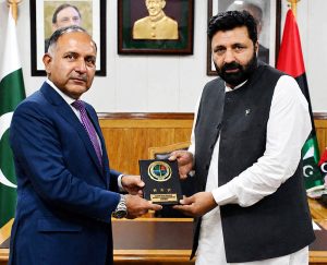 Chairman NDMA Lieutenant General Inam Haider Malik presents a souvenir to Gilgit-Baltistan Chief Minister Amjad Hussain Advocate during a ceremony