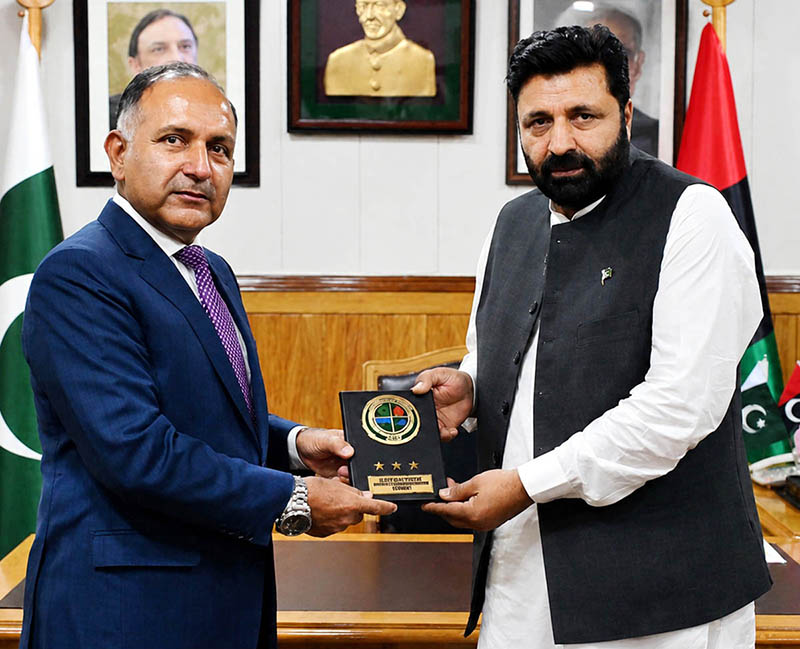 Chairman NDMA Lieutenant General Inam Haider Malik presents a souvenir to Gilgit-Baltistan Chief Minister Amjad Hussain Advocate during a ceremony