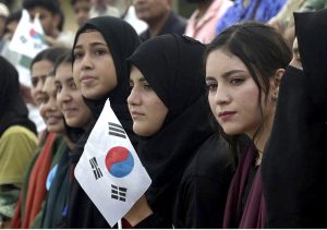 Spectators enjoy the first match of Pakistan-South Korea men's field hockey test series at the Naseer Bunda Hockey Stadium.