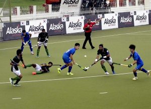 Players in action during the first match of Pakistan-South Korea men's field hockey test series at the Naseer Bunda Hockey Stadium.