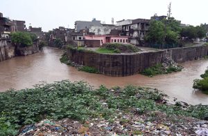 CDA workers clean a drainage nullah along Srinagar Highway as a precautionary measure to ensure the smooth flow of rainwater, prevent urban flooding, and minimize the risk of emergencies during the ongoing monsoon season in the federal capital.
