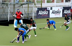Players in action during the first match of Pakistan-South Korea men's field hockey test series at the Naseer Bunda Hockey Stadium.