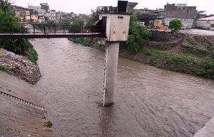 CDA workers clean a drainage nullah along Srinagar Highway as a precautionary measure to ensure the smooth flow of rainwater, prevent urban flooding, and minimize the risk of emergencies during the ongoing monsoon season in the federal capital.