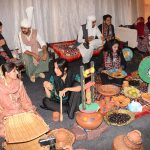 Students dressed in traditional cultural attire participate in a vibrant display of South Punjab's rural heritage during the Mango and Dates Festival 2026 at Muhammad Nawaz Sharif University of Agriculture (MNSUA)