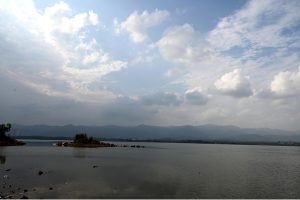 A view of people fishing at Rawal Lake as anglers spend their leisure time along the lakeside