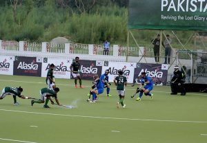 Players in action during the first match of Pakistan-South Korea men's field hockey test series at the Naseer Bunda Hockey Stadium.