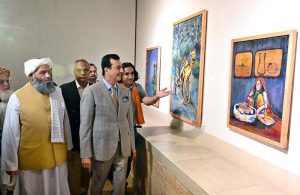Chairman Senate, Syed Yousaf Raza Gilani keenly viewing art work after inaugurate the art exhibition "Sufism & Culture" by Roomi & Aiman at PNCA.
