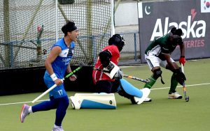 Players in action during the first match of Pakistan-South Korea men's field hockey test series at the Naseer Bunda Hockey Stadium.