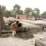 Daily wage labourers prepare reinforced cement concrete (RCC) pipes for drainage and infrastructure projects at a local manufacturing unit in the city